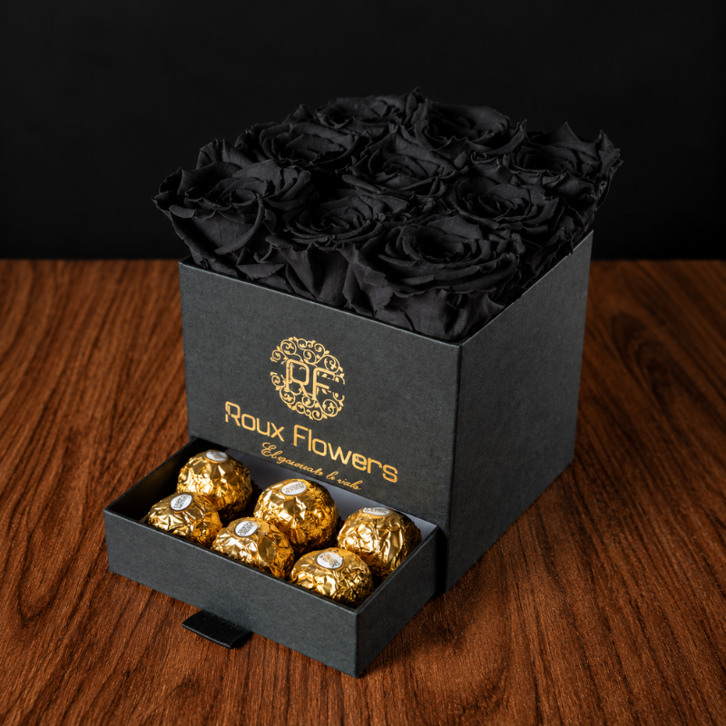 Arreglo floral elegante con 9 rosas negras preservadas y compartimento de bombones Ferrero Rocher