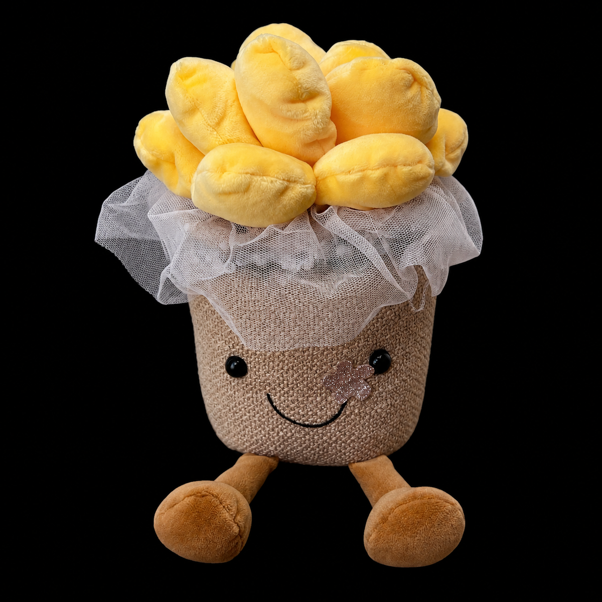 Peluche en forma de maceta sonriente con flores amarillas de felpa y detalle de tul blanco tipo velo de novia